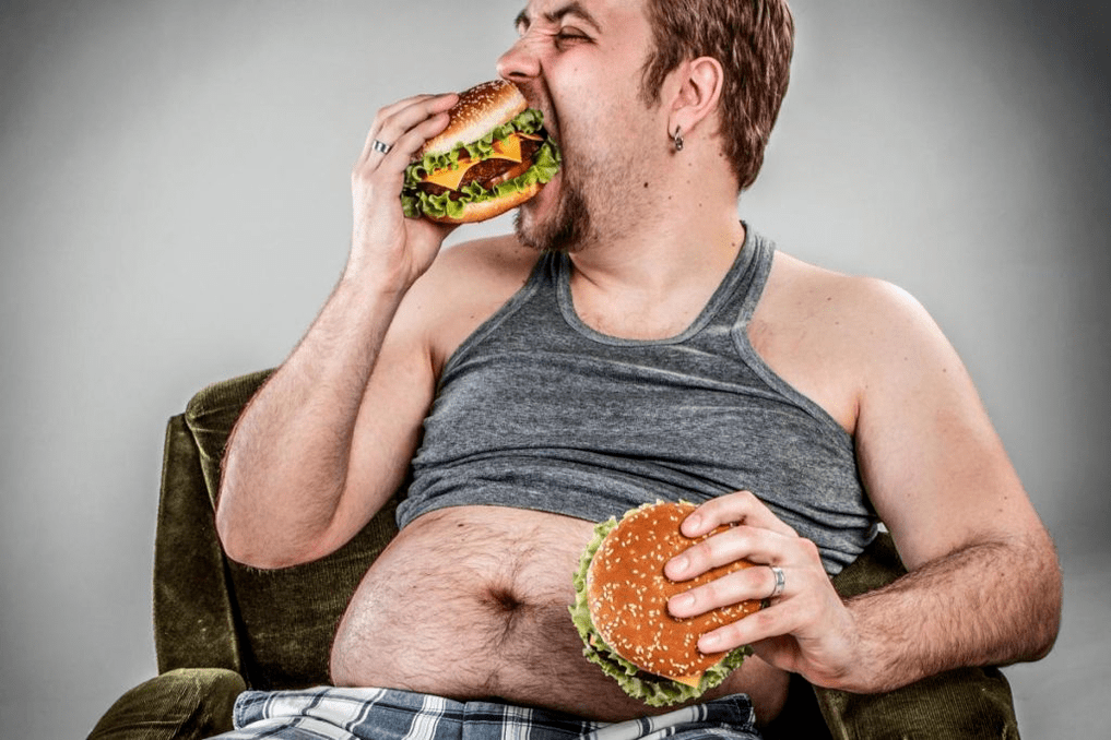 A man eats unwanted food